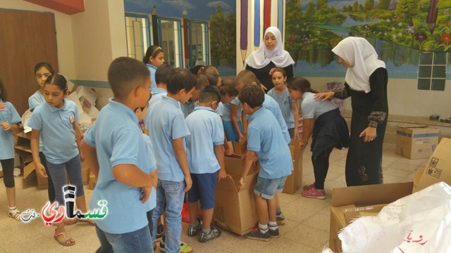 طلاب مدرسة جنة ابن رشد يوزعون الطرود الغذائية للعائلات المحتاجة مع نفحات شهر رمضان المبارك  